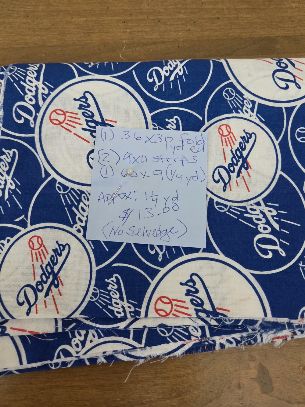 Blue Cotton Fabric with Repeating Sports Logo Print